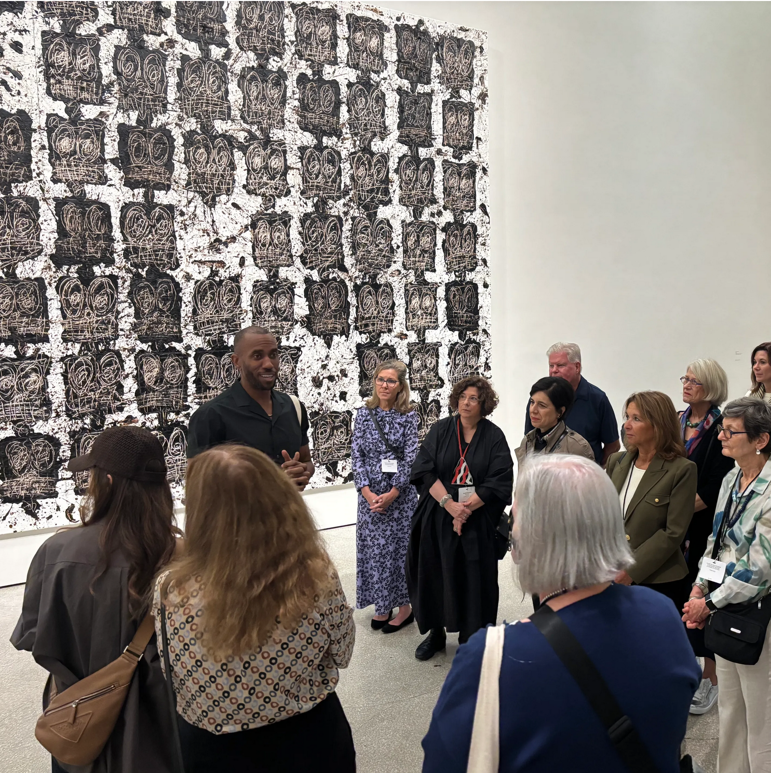 The Block's Board of Advisors gathers around Rashid Johnson next to his work on display at the Guggenheim