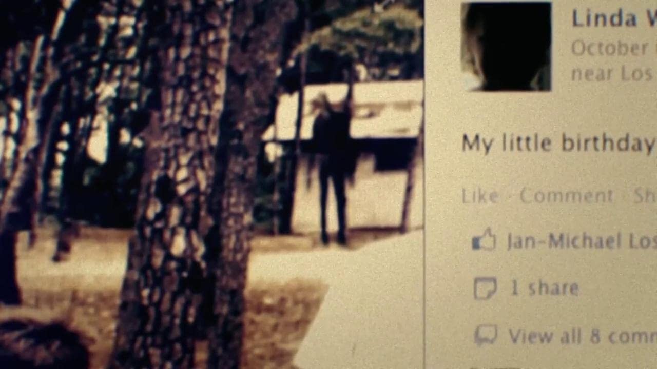 A computer screen showing Facebook post depicting a silhoutted figure standing before a cabin