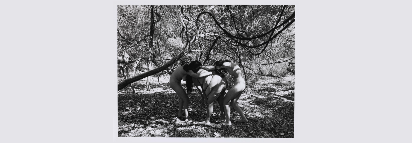 black and white photo of group of nude women outdoors