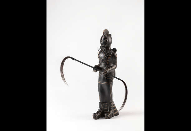 Smooth black sculpture of Human like figure with mask