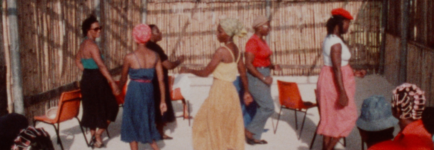 Women gathered in a circle performing 