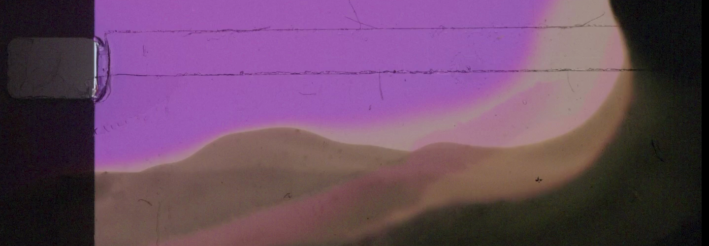 An abstract purple and black film still