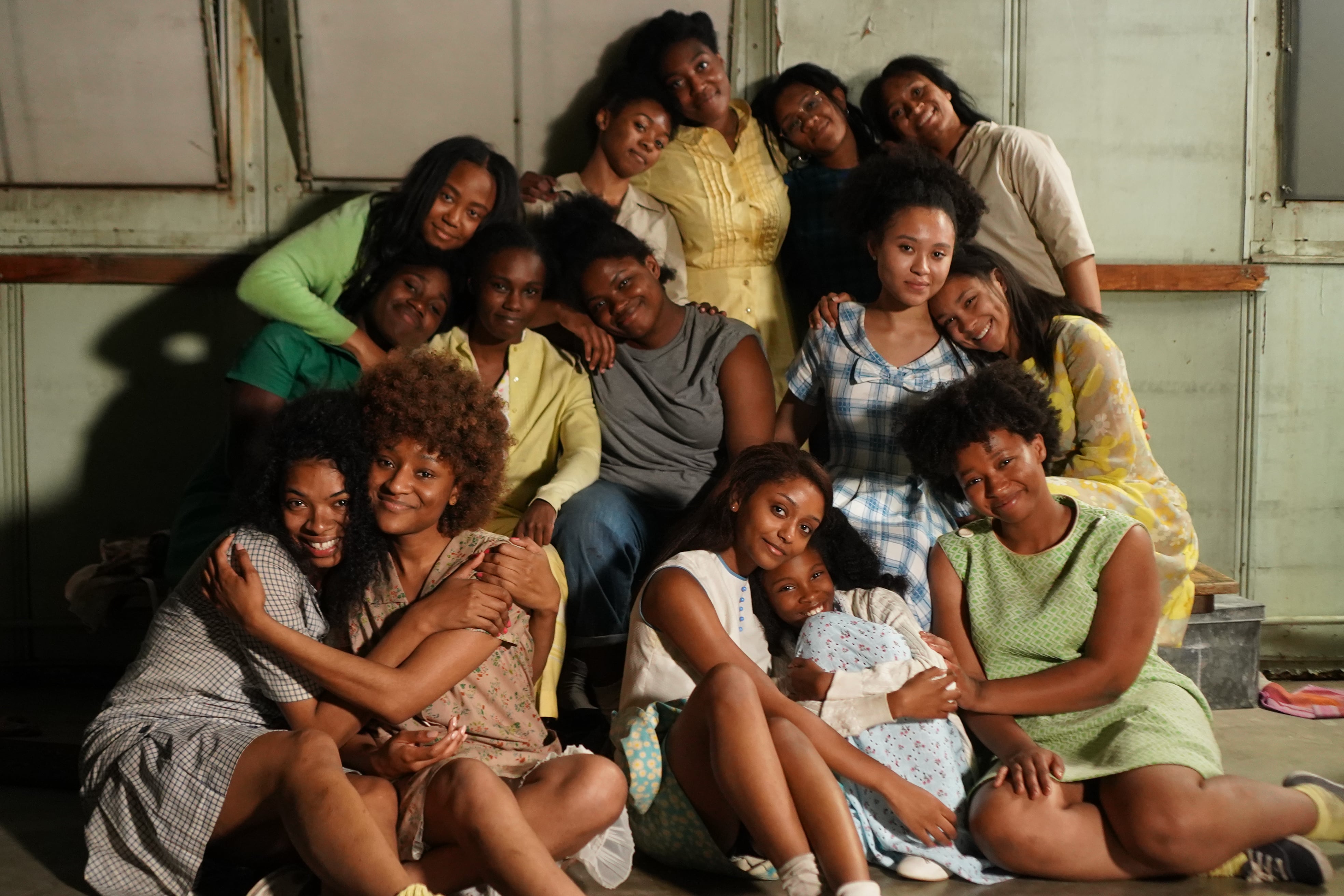 Girls embrace and pose for a portrait