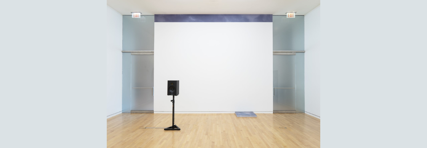 museum wall and glass doors with speaker