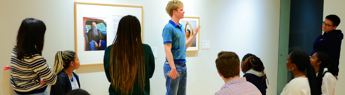 student associate leads a gallery tour